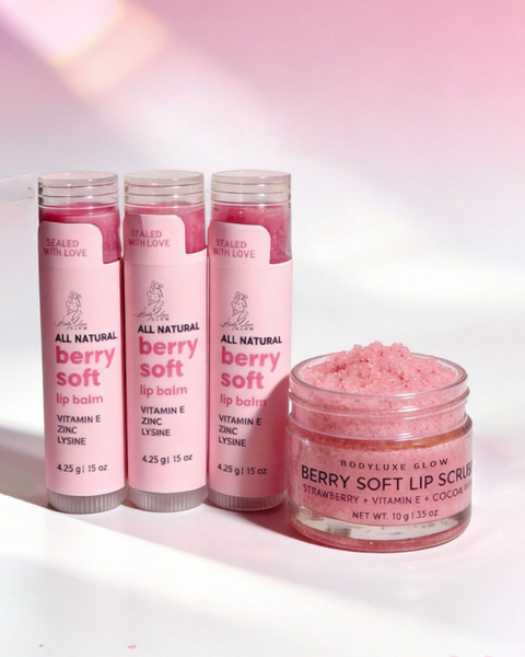 Set of berry soft lip products including lip balms and scrub on a pink gradient background